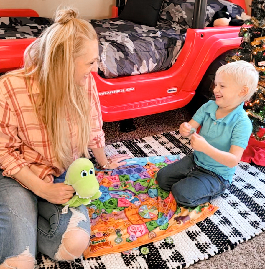 mom and toddler playing soft kids game called Game-A-Saurus Rex and laughing